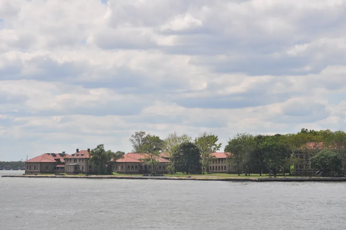 Ellis Island hospital buildings seen from a boat in New York Harbor on an architecture boat tour in New York