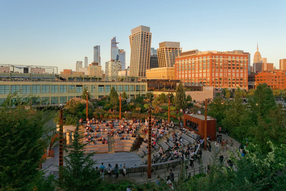 Little Island amphitheater at sunset with Manhattan towers behind, a stop near an architecture boat tour in New York