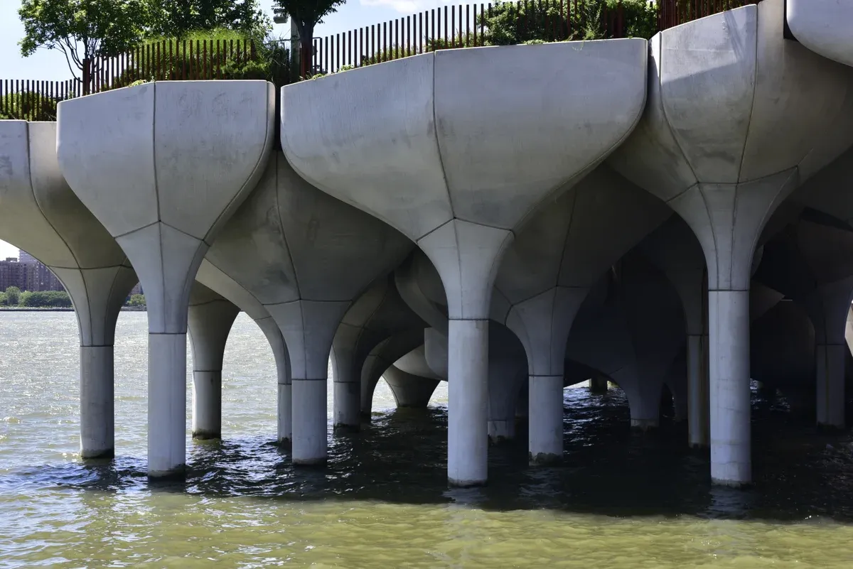 Concrete tulip piles of Little Island on the Hudson, seen from the water on a New York architecture boat tour